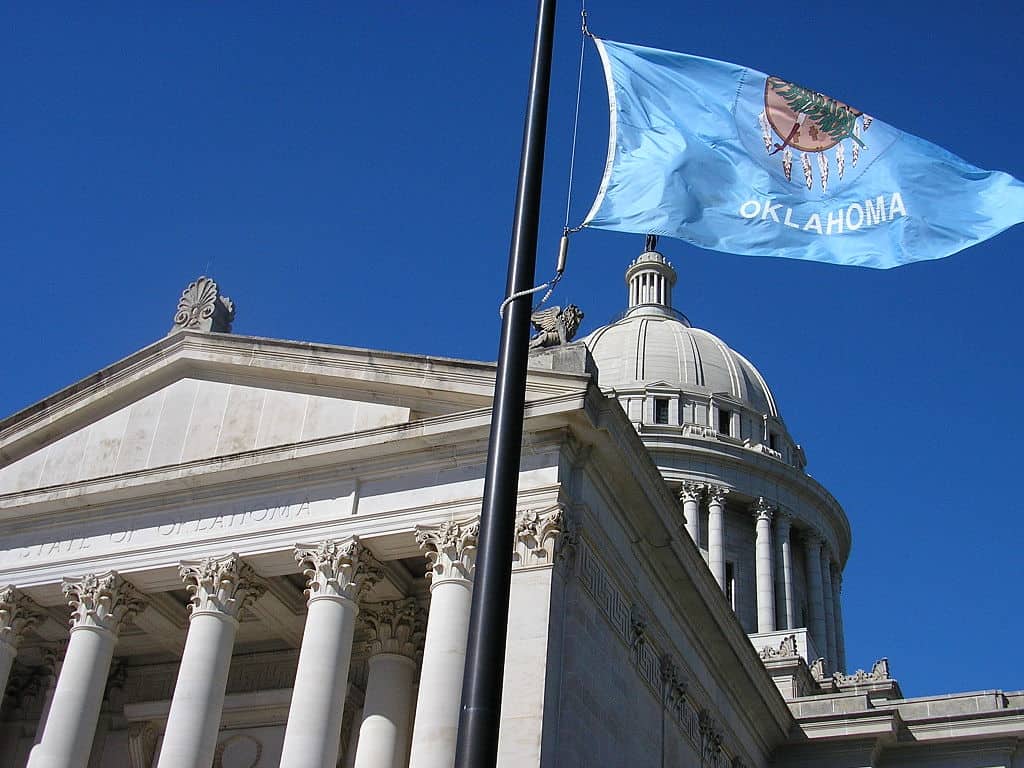 Oklahoma state flag and capitol